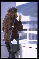 Smoking on the terrace overlooking the city.  Getty Center.  Los Angeles, California.