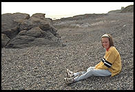 Girl on a rocky beach north of Dublin, Ireland.