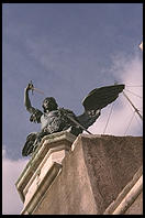 State of the Archangel Michael, atop Castel Sant'Angelo in Rome.  This is by the 18th century Flemish sculptor Pieter Verschaffelt.  Legend has it that in the year 590, the Archangel Michael appeared above the castle.  Now he appears above the castle all day ever day.