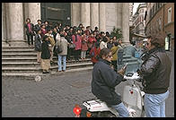 A tour group in Rome (plus some locals), a few steps from the Fontana di Trevi