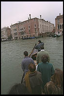 People standing up in the Traghetto Gondola, a micro-ferry service that crosses the Grand Canal at seven points. These cost about 50 cents and hence are by far the cheapest way to get a gondola ride. You're a sissy if you sit down.