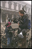 Father, Son, and Pigeons, an old combination in Venice's Piazza San Marco