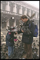 Father, Son, and Pigeons, an old combination in Venice's Piazza San Marco