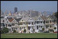 The Painted Ladies Victorian houses of Alamo Square, sometimes referred to as Postcard Row because of the backdrop of downtown skyscrapers.