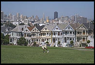 The Painted Ladies Victorian houses of Alamo Square, sometimes referred to as Postcard Row because of the backdrop of downtown skyscrapers.