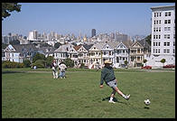 The Painted Ladies Victorian houses of Alamo Square, sometimes referred to as Postcard Row because of the backdrop of downtown skyscrapers.