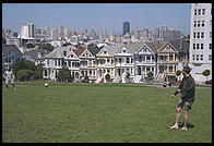 The Painted Ladies Victorian houses of Alamo Square, sometimes referred to as Postcard Row because of the backdrop of downtown skyscrapers.