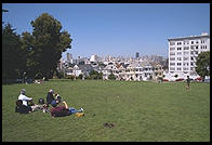 The Painted Ladies Victorian houses of Alamo Square, sometimes referred to as Postcard Row because of the backdrop of downtown skyscrapers.