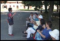 Irena Ravel (Theresienstadt survivor) guiding a tour group.  Small Fortress.  Terezin