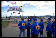 Members of an RV caravan contemplate the beginning of the Alaska Highway.  Dawson Creek, British Columbia.