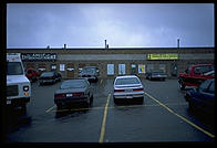 The one decent photo that I took during an entire rainy day in Ontario:  a strip mall with a Canadian Bible Society shop next to an Adult Entertainment Parlour.