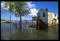 A house with a moat, courtesy of the flooded Mississippi River.  Near St. Charles, Missouri in 1993.