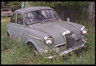 Old car in field. Columbia, California