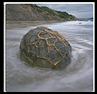 A solo Moeraki Boulder on the east coast of the South Island of New Zealand
