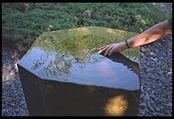 Chere's hand in a fountain at the Isamu Noguchi Garden Museum, Long Island City, Queens, New York