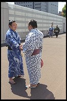 Sumo wrestlers on the sidewalk. Outside the Sumo arena. Ryogoku District. Tokyo